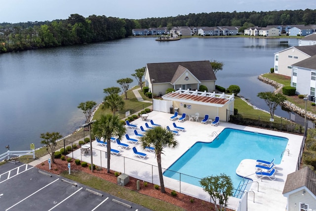 birds eye view of property featuring a water view and a forest view