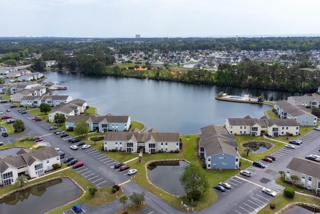 aerial view with a water view and a residential view