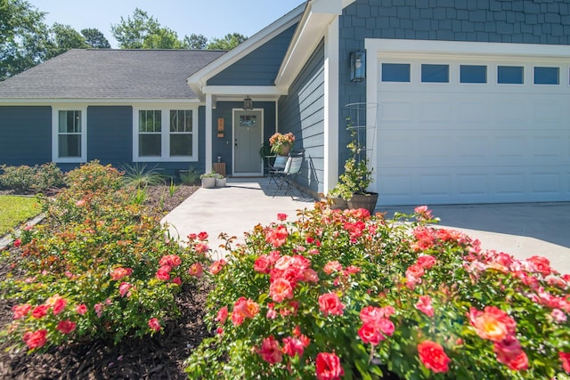 single story home with an attached garage and driveway