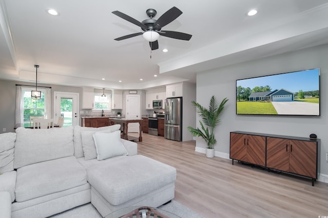 294 Field Loop Rd, Georgetown, SC 29440 - living area featuring recessed lighting, a ceiling fan, baseboards, light wood-style floors, and a raised ceiling