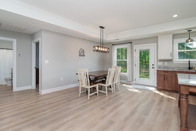 294 Field Loop Rd, Georgetown, SC 29440 - dining room with light wood-style floors, a tray ceiling, baseboards, crown molding, and recessed lighting