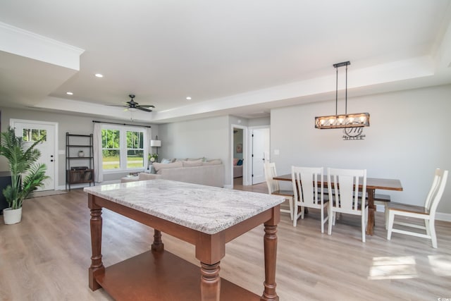 294 Field Loop Rd, Georgetown, SC 29440 - dining room with a tray ceiling, light wood-style floors, recessed lighting, a ceiling fan, and baseboards