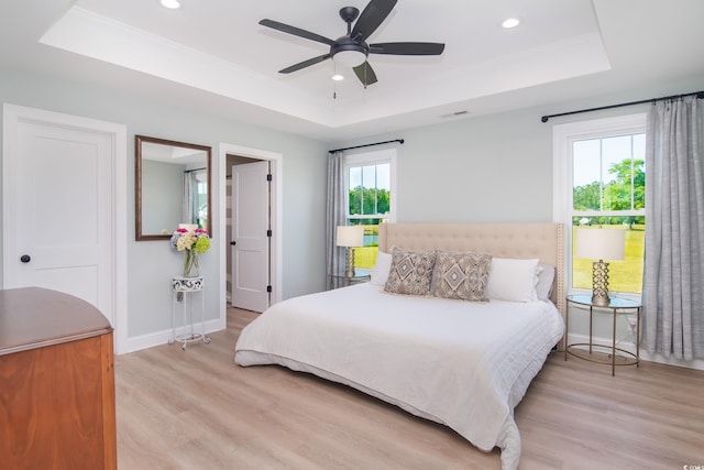 294 Field Loop Rd, Georgetown, SC 29440 - bedroom with a tray ceiling, light wood-style flooring, baseboards, recessed lighting, and a ceiling fan