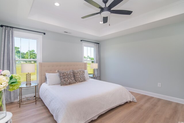 294 Field Loop Rd, Georgetown, SC 29440 - bedroom with a raised ceiling, light wood-style flooring, baseboards, recessed lighting, and a ceiling fan