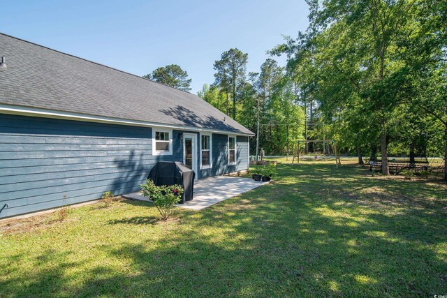 294 Field Loop Rd, Georgetown, SC 29440 - view of grassy yard featuring a patio area