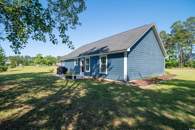 294 Field Loop Rd, Georgetown, SC 29440 - rear view of property with a lawn, a patio, and a shingled roof
