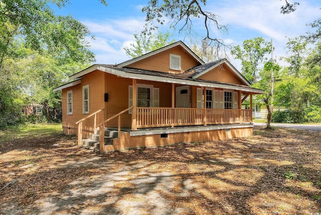 chalet / cabin with covered porch