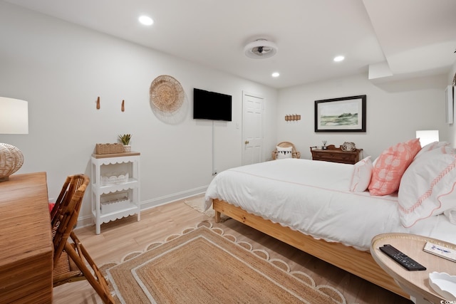 bedroom with recessed lighting, baseboards, and light wood-style floors