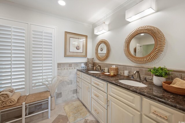 109 Pioneer Loop, Georgetown, SC 29440 - full bathroom featuring double vanity, crown molding, and tile walls