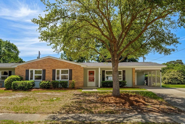 617 Hibiscus Ave Unit 617, Myrtle Beach, SC 29577 - single story home featuring driveway, a front yard, brick siding, a shingled roof, and an attached carport