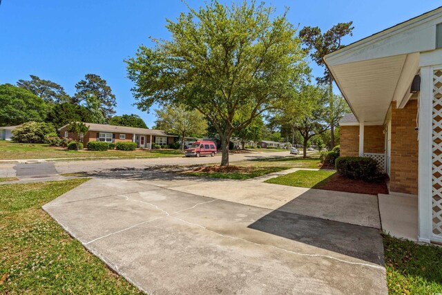 617 Hibiscus Ave Unit 617, Myrtle Beach, SC 29577 - view of yard with driveway