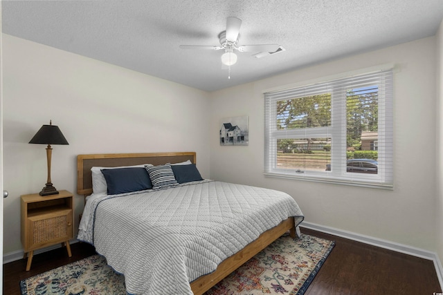 617 Hibiscus Ave Unit 617, Myrtle Beach, SC 29577 - bedroom featuring baseboards, a textured ceiling, ceiling fan, and wood finished floors