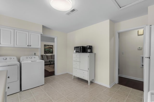 617 Hibiscus Ave Unit 617, Myrtle Beach, SC 29577 - laundry room with light tile patterned floors, cabinet space, independent washer and dryer, and visible vents