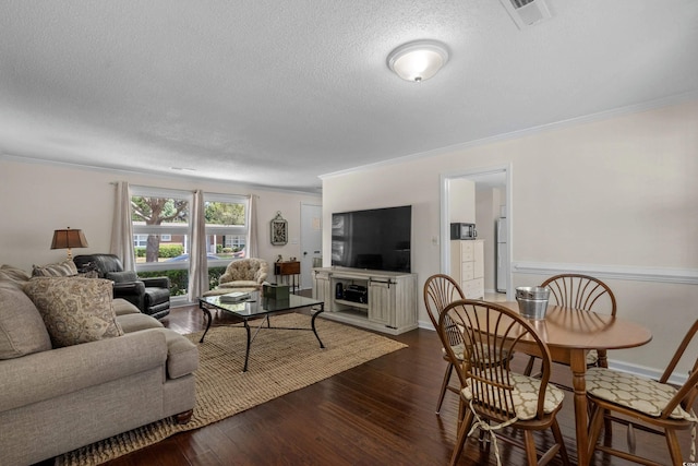 617 Hibiscus Ave Unit 617, Myrtle Beach, SC 29577 - living room with ornamental molding, dark wood-style floors, a textured ceiling, and visible vents