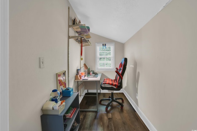 office with baseboards, vaulted ceiling, and wood finished floors