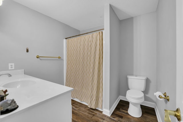 full bath with vanity, toilet, wood finished floors, and a shower with shower curtain