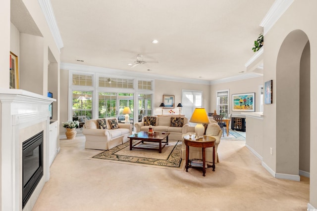1617 Tradition Club Dr, Pawleys Island, SC 29585 - living room with light colored carpet, ornamental molding, and a glass covered fireplace