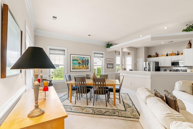 1617 Tradition Club Dr, Pawleys Island, SC 29585 - dining room featuring baseboards, visible vents, ornamental molding, and light carpet
