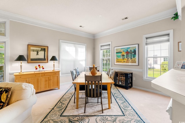 1617 Tradition Club Dr, Pawleys Island, SC 29585 - dining area featuring crown molding, plenty of natural light, light carpet, and visible vents