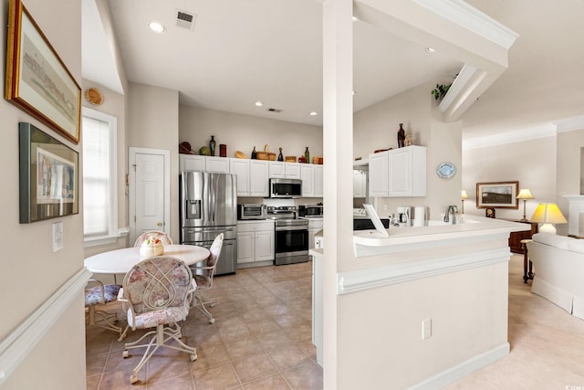 1617 Tradition Club Dr, Pawleys Island, SC 29585 - kitchen with visible vents, a toaster, white cabinets, stainless steel appliances, and recessed lighting