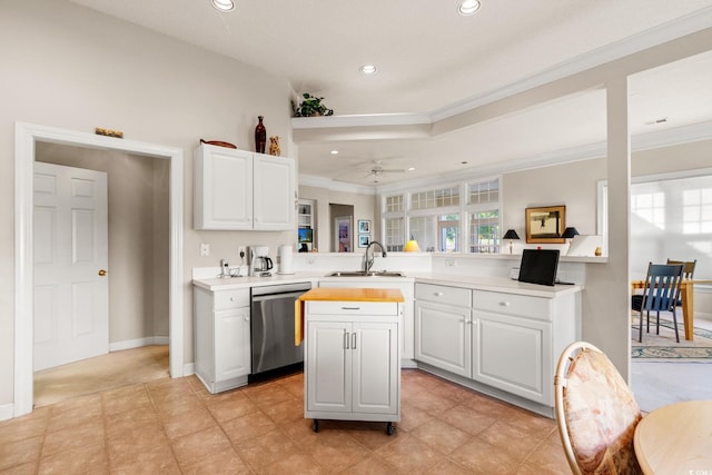 1617 Tradition Club Dr, Pawleys Island, SC 29585 - kitchen featuring crown molding, stainless steel dishwasher, a sink, light countertops, and a peninsula