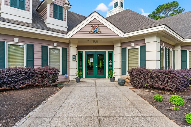 1617 Tradition Club Dr, Pawleys Island, SC 29585 - view of exterior entry with french doors and a shingled roof
