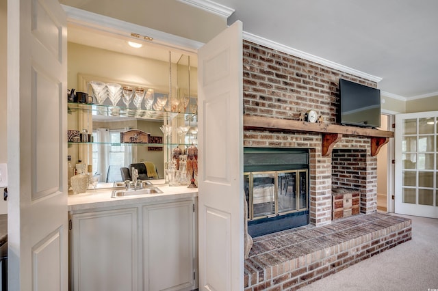 8209 Timber Ridge Rd, Conway, SC 29526 - carpeted living room with a fireplace, crown molding, and a sink