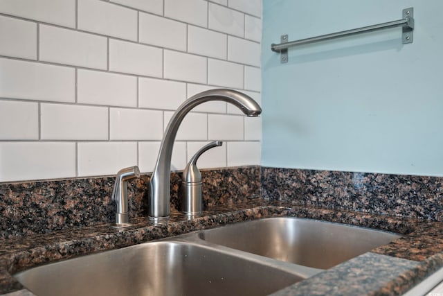 room details with backsplash and a sink