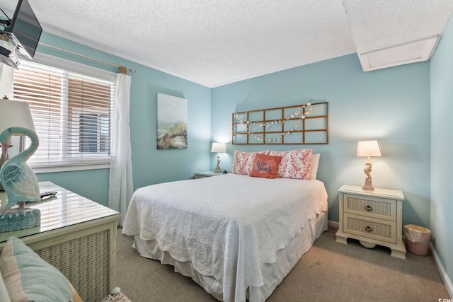 carpeted bedroom with baseboards and a textured ceiling