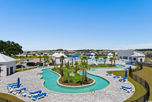 surrounding community featuring a residential view and fence