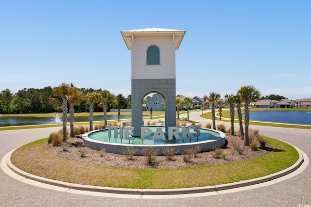 view of community with a water view