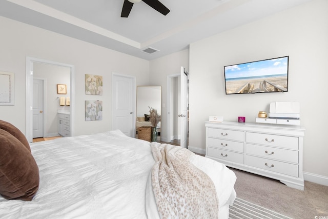 bedroom featuring visible vents, baseboards, ensuite bathroom, and ceiling fan