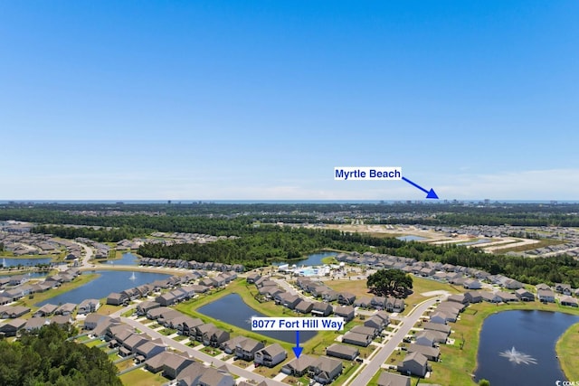 birds eye view of property featuring a water view and a residential view