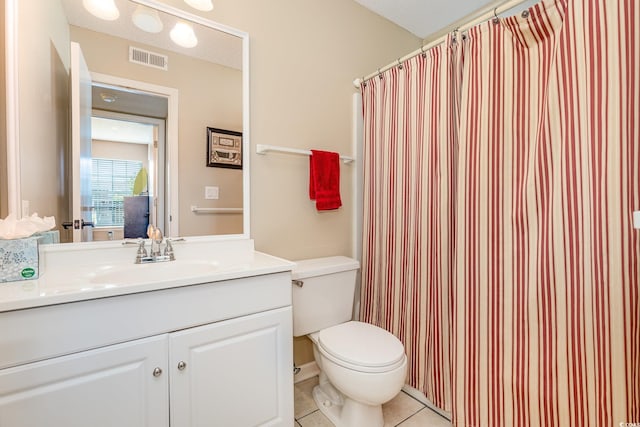bathroom featuring vanity, toilet, tile patterned floors, a shower with curtain, and visible vents