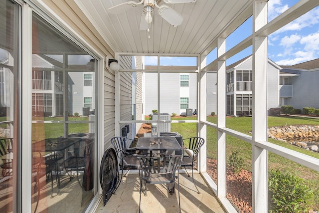 sunroom featuring plenty of natural light and a ceiling fan