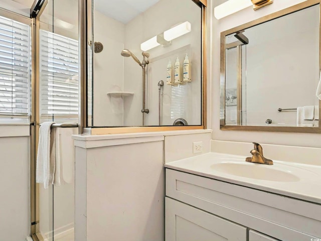 full bathroom featuring a shower stall and vanity