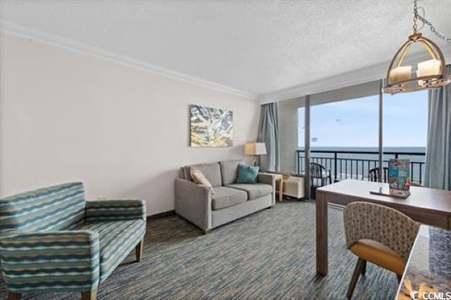 1105 S Ocean Blvd Unit 630, Myrtle Beach, SC 29577 - carpeted living room featuring a wall of windows, a water view, ornamental molding, a textured ceiling, and baseboards
