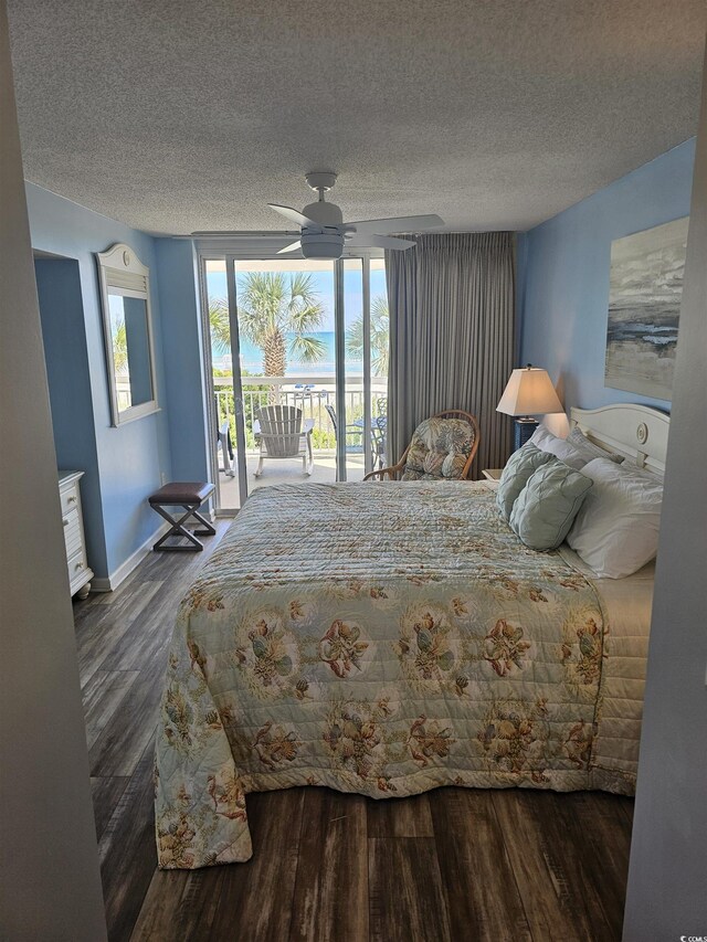 bedroom with access to outside, dark wood finished floors, a textured ceiling, baseboards, and ceiling fan