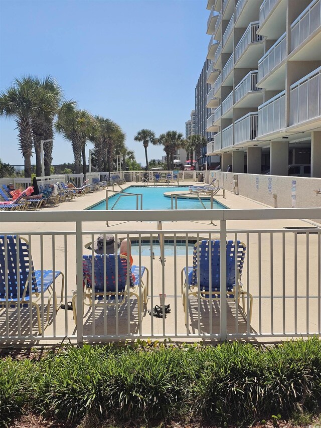 community pool with a patio