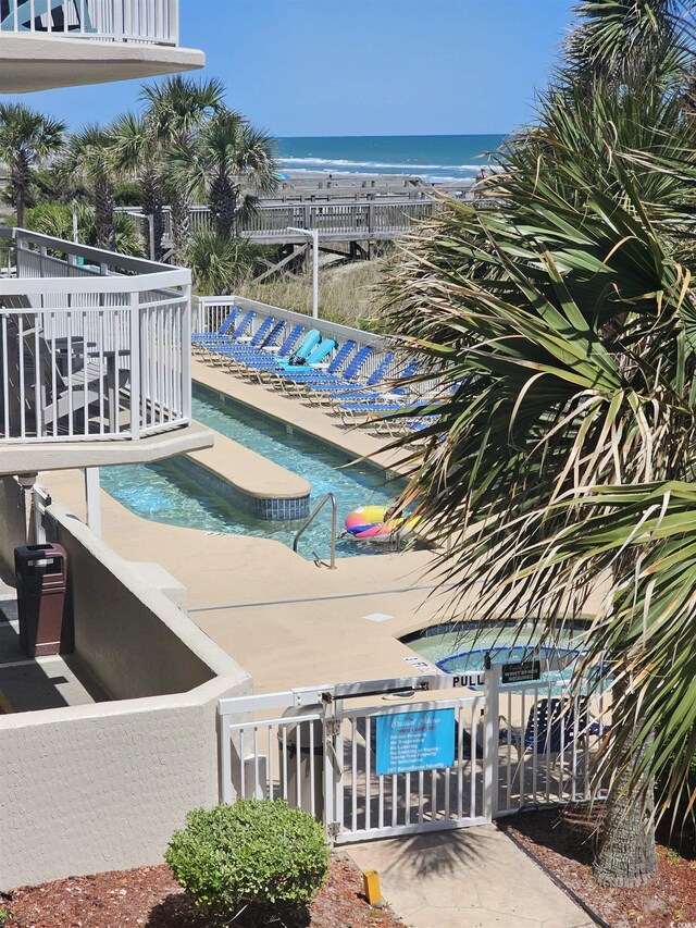community pool featuring a water view