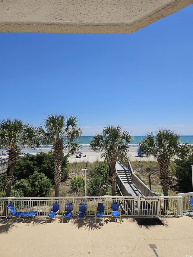 water view with nearby beach and fence