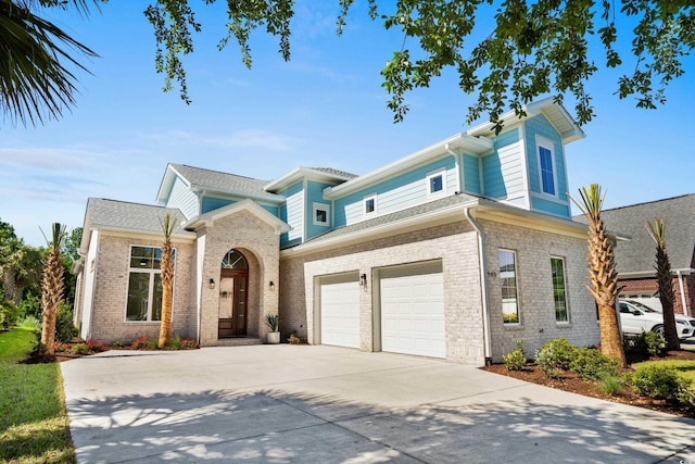 985 Shipmaster Ave, Myrtle Beach, SC 29579 - view of front facade featuring a garage, concrete driveway, and brick siding
