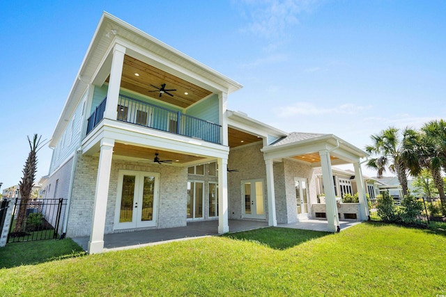 985 Shipmaster Ave, Myrtle Beach, SC 29579 - back of house featuring a ceiling fan, a balcony, a yard, and french doors