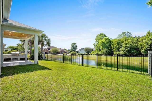 985 Shipmaster Ave, Myrtle Beach, SC 29579 - view of yard with a patio, a fenced backyard, exterior kitchen, and a water view