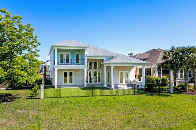 985 Shipmaster Ave, Myrtle Beach, SC 29579 - back of property featuring french doors, ceiling fan, a lawn, and a fenced backyard