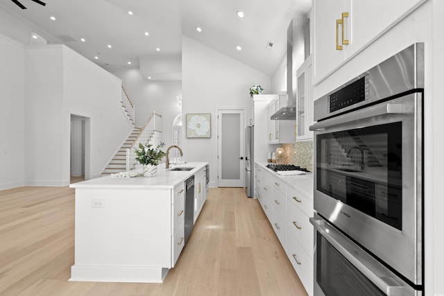 985 Shipmaster Ave, Myrtle Beach, SC 29579 - kitchen with decorative backsplash, high vaulted ceiling, white cabinetry, a sink, and appliances with stainless steel finishes
