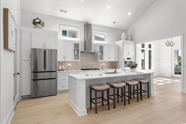 985 Shipmaster Ave, Myrtle Beach, SC 29579 - kitchen with a sink, light wood-style floors, wall chimney exhaust hood, freestanding refrigerator, and wall oven
