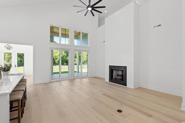 985 Shipmaster Ave, Myrtle Beach, SC 29579 - unfurnished living room with plenty of natural light, light wood-style flooring, a high ceiling, and visible vents