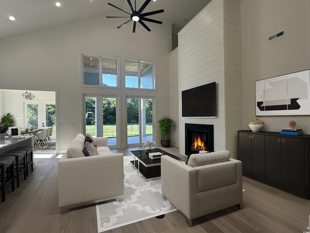 985 Shipmaster Ave, Myrtle Beach, SC 29579 - living area featuring light wood-style floors, high vaulted ceiling, a large fireplace, recessed lighting, and visible vents