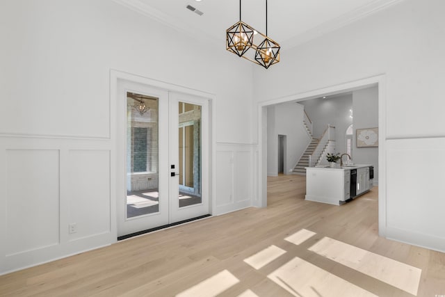 985 Shipmaster Ave, Myrtle Beach, SC 29579 - unfurnished dining area featuring visible vents, a decorative wall, a notable chandelier, and stairway